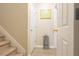 Hallway featuring a small gray table and stairway to the left at 342 Holbrook Rd, Smyrna, GA 30082