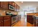 Well-lit kitchen featuring stainless steel appliances, wooden cabinets, and tiled backsplash at 342 Holbrook Rd, Smyrna, GA 30082