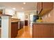 Open kitchen featuring wood cabinets, stainless steel appliances, and tile backsplash at 342 Holbrook Rd, Smyrna, GA 30082