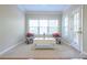 Cozy living room with neutral carpet, large windows, and elegant furniture at 342 Holbrook Rd, Smyrna, GA 30082