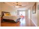 Primary bedroom with wood floors, ceiling fan and tray ceiling at 342 Holbrook Rd, Smyrna, GA 30082