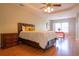 Spacious main bedroom featuring wood floors and ceiling fan with light at 342 Holbrook Rd, Smyrna, GA 30082