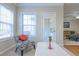 Bright, cozy sitting room with elegant furnishings, natural light, and view to deck at 342 Holbrook Rd, Smyrna, GA 30082