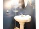 Small bathroom with pedestal sink and shower/tub combo at 4620 Sammy Dr, Powder Springs, GA 30127