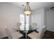 Dining room with glass table and chairs near kitchen access at 4620 Sammy Dr, Powder Springs, GA 30127