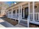 White columns and railings enhance the home's curb appeal at 4620 Sammy Dr, Powder Springs, GA 30127