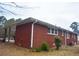 Brick house exterior with a carport and landscaping at 4751 Brownsville Rd, Powder Springs, GA 30127