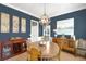 Formal dining room with a round table, sideboard, and hardwood floors at 100 Kendemere Pointe, Roswell, GA 30075