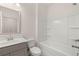 Clean bathroom with tub, shower, vanity and toilet at 13553 Whitman Se Ln, Covington, GA 30014