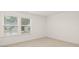 Well-lit bedroom featuring neutral walls and carpet at 13553 Whitman Se Ln, Covington, GA 30014