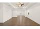 Bright bedroom with hardwood floors and ceiling fan at 13553 Whitman Se Ln, Covington, GA 30014