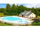 Community pool with separate kiddie pool and clubhouse at 13553 Whitman Se Ln, Covington, GA 30014