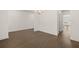 Spacious dining room with hardwood floors and access to kitchen at 13553 Whitman Se Ln, Covington, GA 30014