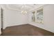 Bright dining room with hardwood floors and chandelier at 13553 Whitman Se Ln, Covington, GA 30014