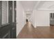Bright entryway with hardwood floors leading to the living area at 13553 Whitman Se Ln, Covington, GA 30014