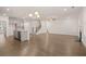 Open concept kitchen with island and hardwood floors at 13553 Whitman Se Ln, Covington, GA 30014