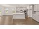 Open concept kitchen with island and stainless steel appliances at 13553 Whitman Se Ln, Covington, GA 30014