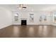 Spacious living room featuring hardwood floors and fireplace at 13553 Whitman Se Ln, Covington, GA 30014
