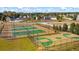 Community tennis and basketball courts with green surfaces at 13553 Whitman Se Ln, Covington, GA 30014