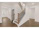 Elegant staircase with wood and metal accents at 13553 Whitman Se Ln, Covington, GA 30014
