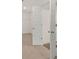 Spacious walk-in closet with ample shelving and hanging space at 13553 Whitman Se Ln, Covington, GA 30014
