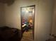 View of a small bedroom with ceiling fan, assorted items and unkempt carpet at 3453 Woodlawn Cir, Tucker, GA 30084