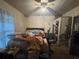 Bedroom with a bed, dresser, and personal items at 3453 Woodlawn Cir, Tucker, GA 30084