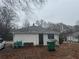 Exterior view of the back of the house on a lot with a small side yard at 3453 Woodlawn Cir, Tucker, GA 30084