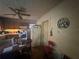 Functional kitchen with vintage cabinetry, a dining table, and standard appliances at 3453 Woodlawn Cir, Tucker, GA 30084
