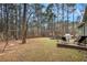 Spacious backyard with patio and wooded area at 6308 Emerald Se Trl, Acworth, GA 30102