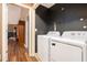 Convenient laundry room with washer and dryer, and access to other areas at 6308 Emerald Se Trl, Acworth, GA 30102