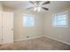 A bright bedroom featuring a ceiling fan and two windows at 1658 Hollyhock Ter, Decatur, GA 30032