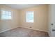 A bright bedroom featuring two windows at 1658 Hollyhock Ter, Decatur, GA 30032
