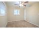 This bright bedroom features a ceiling fan and a window at 1658 Hollyhock Ter, Decatur, GA 30032
