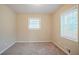 A bright bedroom featuring two windows at 1658 Hollyhock Ter, Decatur, GA 30032