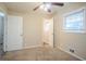 A bright bedroom featuring a ceiling fan and two windows at 1658 Hollyhock Ter, Decatur, GA 30032