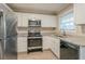 Modern kitchen with stainless steel appliances, granite countertops and lots of cabinets at 1658 Hollyhock Ter, Decatur, GA 30032