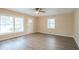 Bright living room with hard surface floors, ceiling fan and lots of natural light at 1658 Hollyhock Ter, Decatur, GA 30032