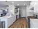 White kitchen with stainless steel appliances and herringbone backsplash at 2797 Malton Way, Loganville, GA 30052