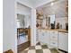 Stylish coffee bar with white cabinets and patterned wallpaper at 4290 Valley Trail Se Dr, Atlanta, GA 30339