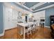 Spacious kitchen featuring white cabinets, island, and stainless steel appliances at 4605 Woodlawn Gates Ln, Marietta, GA 30068