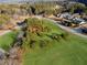 Expansive land featuring mature trees and lush greenery, bordered by roads and residential areas at 5422 Hill Sw Rd, Powder Springs, GA 30127