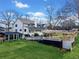 Backyard view of home with covered deck, expansive yard and a walk-out basement entrance at 5422 Hill Sw Rd, Powder Springs, GA 30127