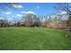 Expansive backyard leading to a tranquil waterfront, providing ample space for outdoor activities at 5422 Hill Sw Rd, Powder Springs, GA 30127