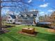 Well-maintained backyard featuring a charming well, beautiful landscaping, and stylish architecture at 5422 Hill Sw Rd, Powder Springs, GA 30127