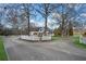 Long driveway leads to white home with white picket fence, set back on a large grassy lot at 5422 Hill Sw Rd, Powder Springs, GA 30127