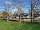 Charming white farmhouse with a covered front porch and ample greenery around the property at 5422 Hill Sw Rd, Powder Springs, GA 30127