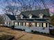 Two-story home with white exterior, shutters, and porch at 5422 Hill Sw Rd, Powder Springs, GA 30127