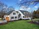Aerial of a charming home boasting a fresh coat of white paint and well-manicured landscaping at 5422 Hill Sw Rd, Powder Springs, GA 30127