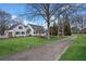 Charming white farmhouse with black shutters, lush lawn, and inviting driveway at 5422 Hill Sw Rd, Powder Springs, GA 30127